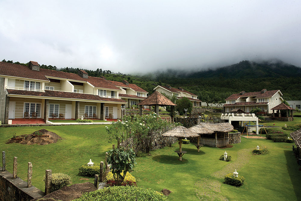 Misty exterior view of Munnar from The Siena Village resort
